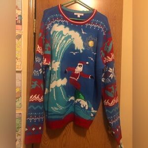 Festive Blue and Red Santa Surfing Sweater